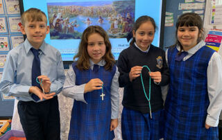 St Charles Waverley Students holding Rosary beads